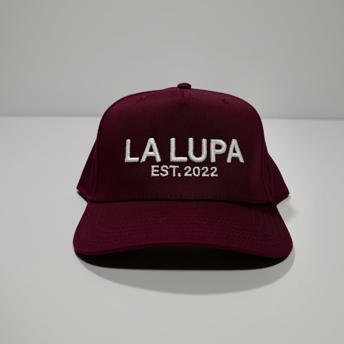 Maroon Hat Written
