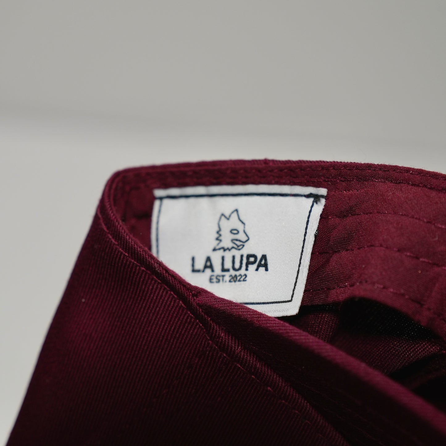 Maroon Hat Written